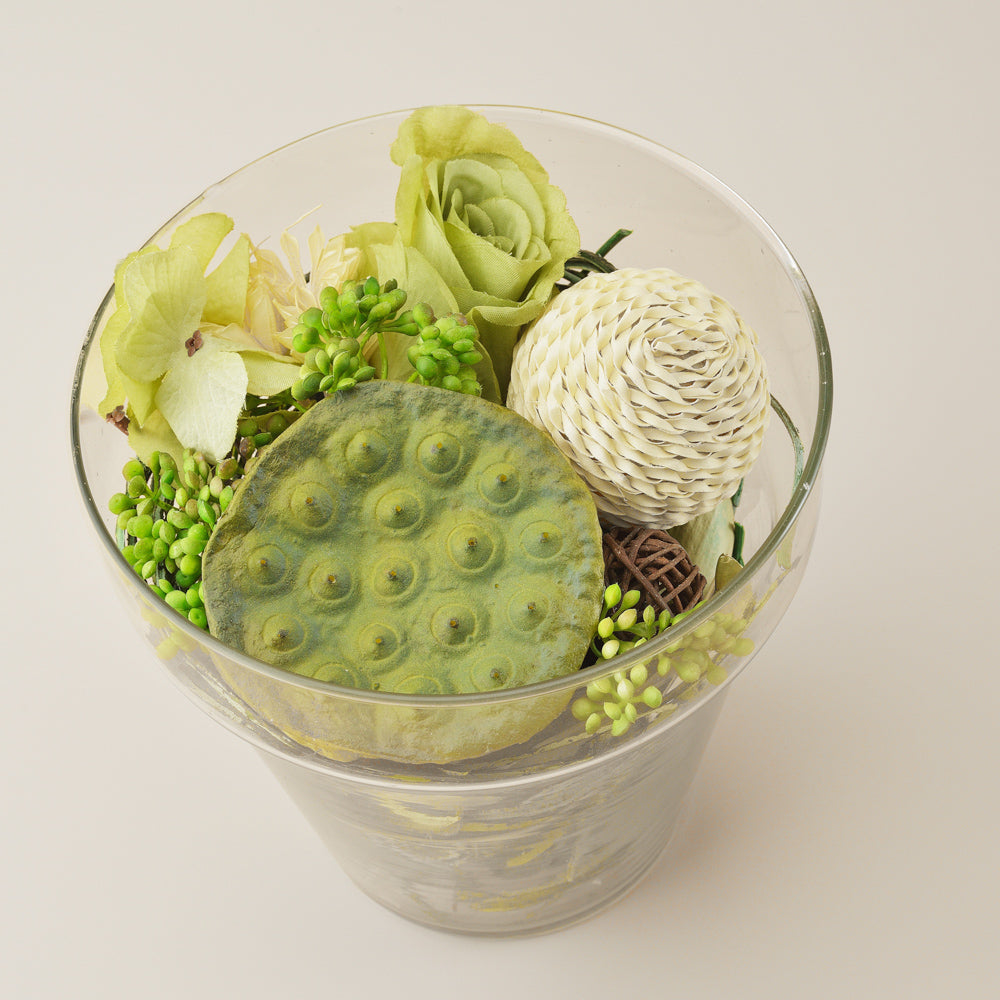 Artificial Green Floral Arrangement in a Glass Vas
